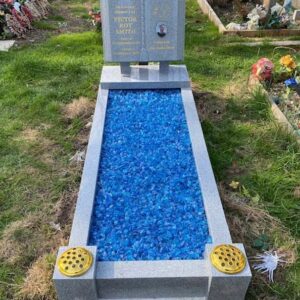 Grey granite book kerbed kerbside headstone