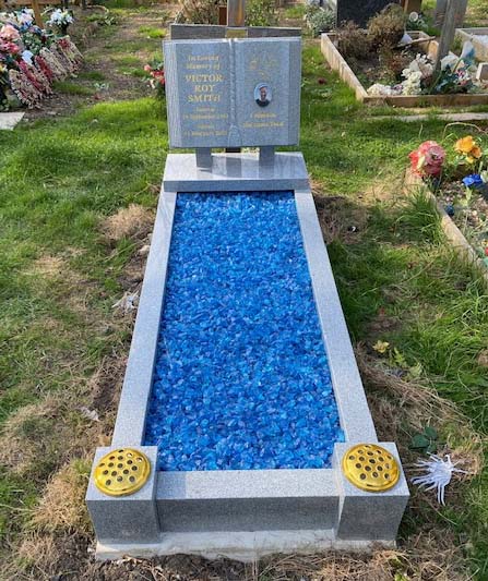 Grey granite book kerbed kerbside headstone